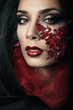 Foto: portrait of passionate woman with red gemstones portrait of passionate woman with red gemstones