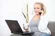 Photo: Woman with computer and coffee cup Woman with computer and coffee cup