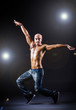 Dancer dancing in the dark studio
