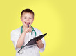 Foto: Funny child with doctor uniform Funny child with doctor uniform
