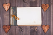 Notebook and hearts on wood background