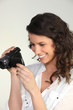 Photo: Woman using a camcorder Woman using a camcorder