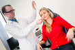 Optometry concept - pretty young woman having her eyes examined