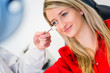 Optometry concept - pretty young woman having her eyes examined