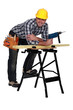 Carpenter with drill casually leaning on work bench