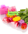 Beautiful tulips in bouquet with gifts and note isolated