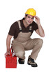 Construction worker posing with his toolbox
