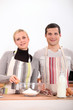 Photo: Couple baking in the kitchen Couple baking in the kitchen