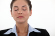 Businesswoman with her eyes closed