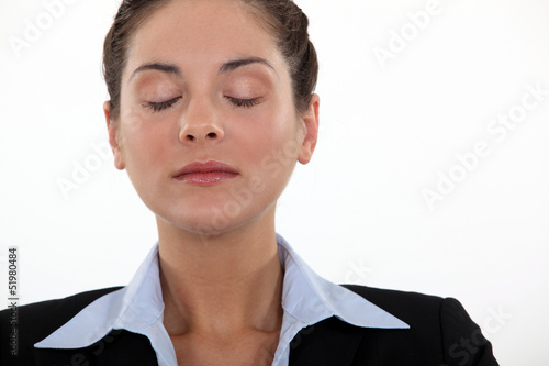 Photo: Businesswoman with her eyes closed Businesswoman with her eyes closed