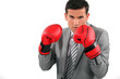 Businessman wearing boxing gloves