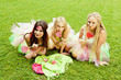 group of beautiful female friends smiling.  three pretty  girls