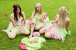 group of beautiful female friends smiling.  three pretty  girls