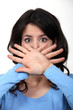 Photo: Woman hiding her mouth Woman hiding her mouth