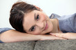 Woman lying on couch