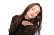 Cute young woman blowing a kiss