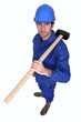 Photo: Craftsman with hammer on shoulder Craftsman with hammer on shoulder