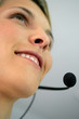 Photo: Close-up shot of a woman wearing a headset Close-up shot of a woman wearing a headset