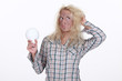 Young woman holding light-bulb