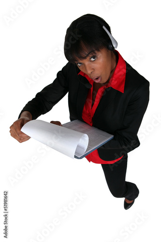 Photo: Businesswoman shocked by document Businesswoman shocked by document