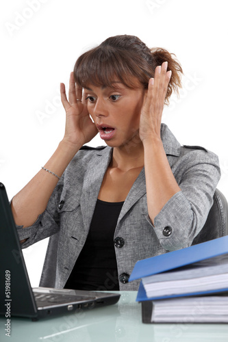 Photo: Distressed woman with laptop Distressed woman with laptop