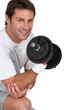 Photo: Man lifting weights Man lifting weights