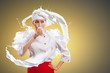 Asian female cook against milk splashes