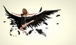 Woman floating   on dark wings