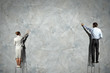 Photo: businesspeople drawing diagrams on wall businesspeople drawing diagrams on wall
