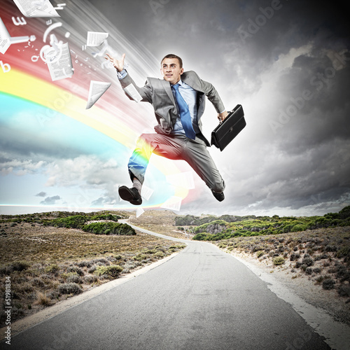 Photo: Businessman running on the road Businessman running on the road