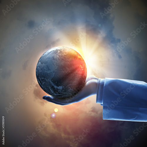 Photo: Image of earth planet on hand Image of earth planet on hand
