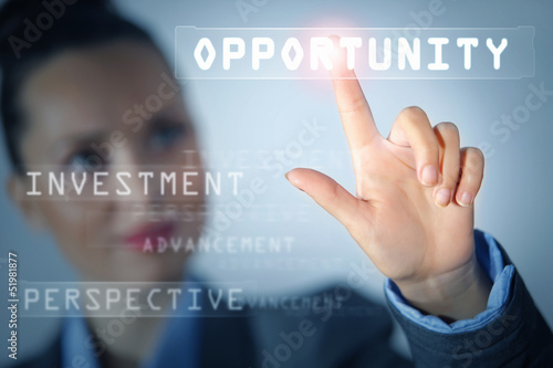 Photo: Business woman touching display Business woman touching display