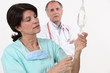 Photo: nurse and doctor in background nurse and doctor in background