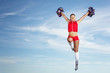Photo: Young female cheerleader Young female cheerleader