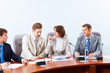Four businesspeople at meeting
