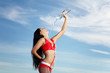 Young female sport girl with a bottle of water