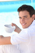 Photo: portrait of a man drinking coffee portrait of a man drinking coffee