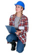 Female construction worker with a clipboard