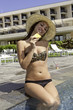 Photo: teen at a pool eating pineapple teen at a pool eating pineapple