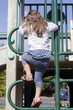 Photo: Girl climbing up a ladder Girl climbing up a ladder