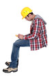 Photo: Tradesman holding a multimeter Tradesman holding a multimeter