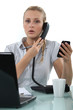 Worker with two phones