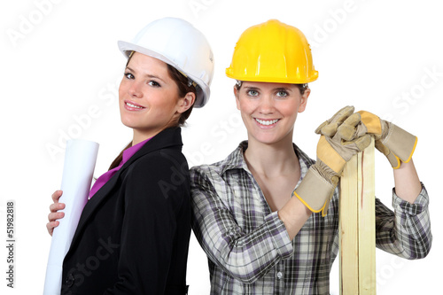 Photo: female architect stood with female carpenter female architect stood with female carpenter