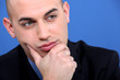Photo: Pensive bald businessman Pensive bald businessman