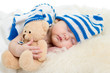 newborn baby sleeping on fur bed