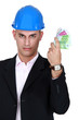 Foto: Young architect holding bank notes Young architect holding bank notes