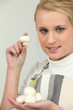 Photo: Young woman with a handful of button mushrooms Young woman with a handful of button mushrooms