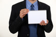 Photo: Man showing notebook Man showing notebook