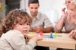 Photo: Family playing board games. Family playing board games.