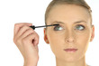 Blond applying mascara